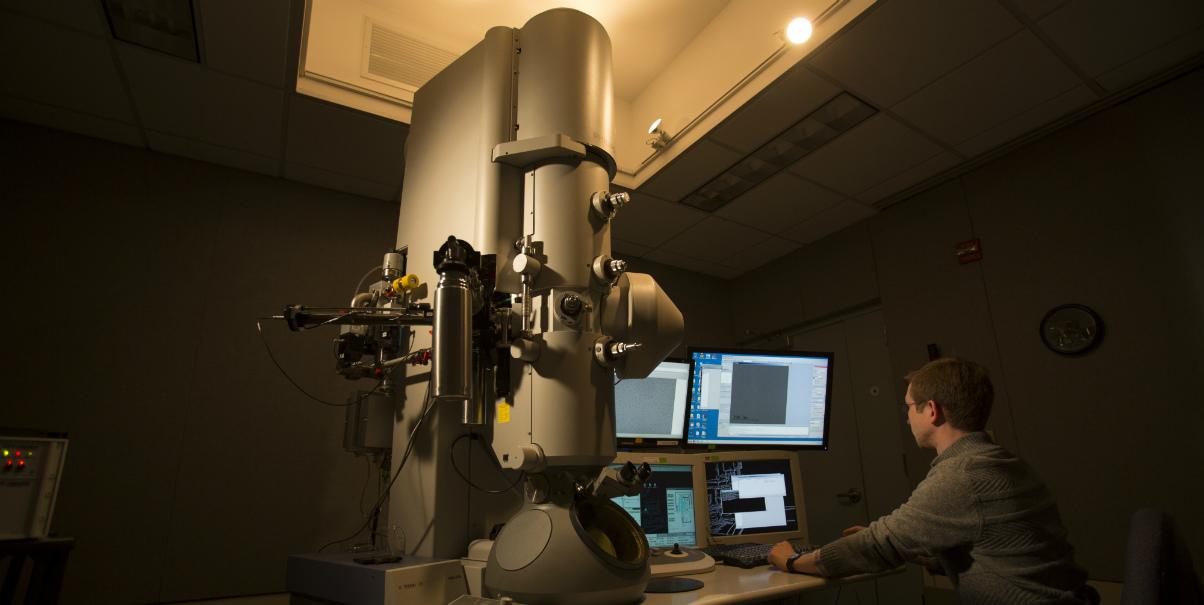 Researcher at lab equipment